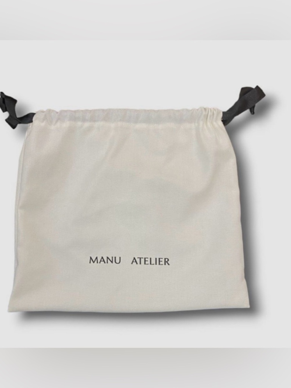 MANU Atelier Dust Bag in White with Black Logo